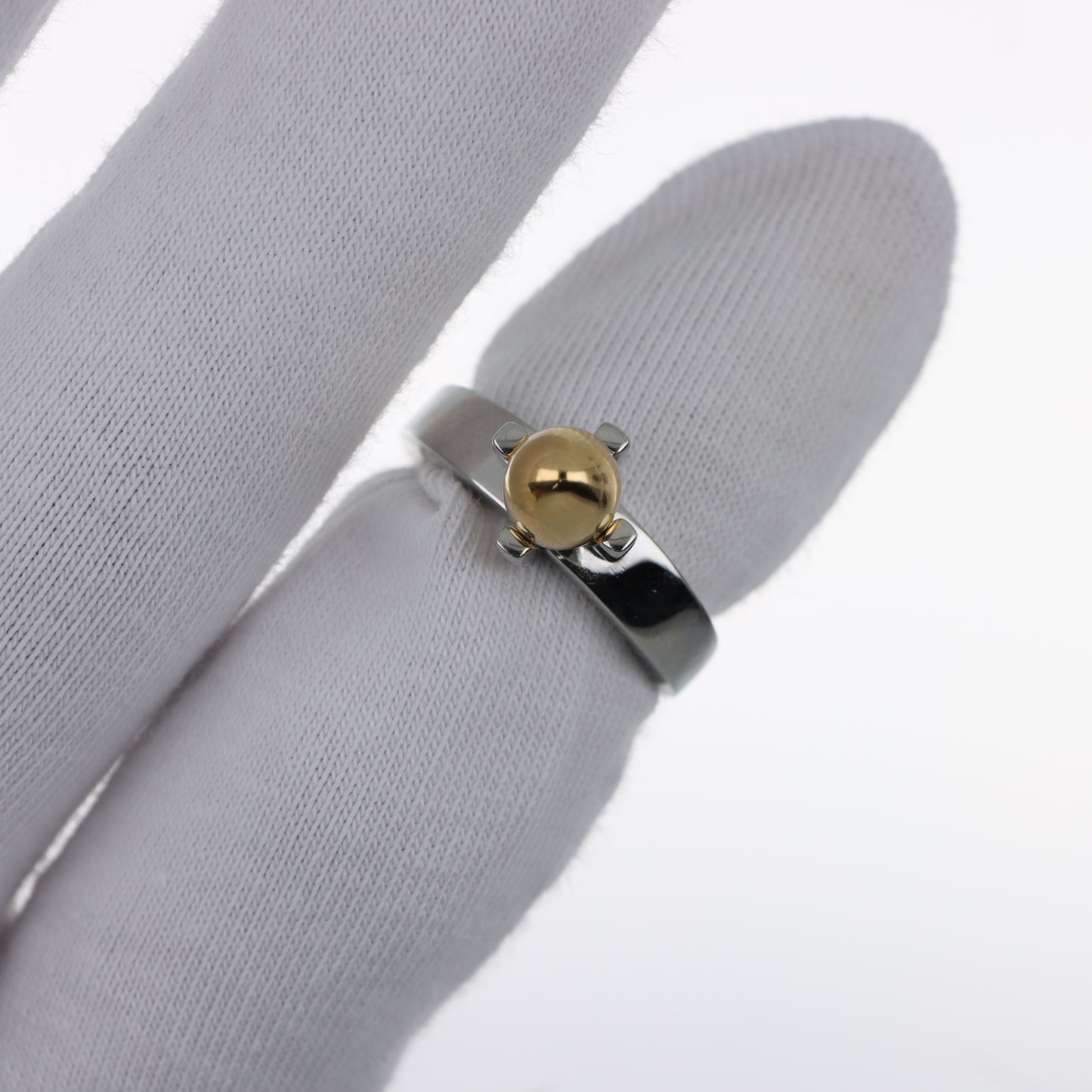 Moschino – Anello Uovo Dorato su Fascia Acciaio Lucido Bicolor