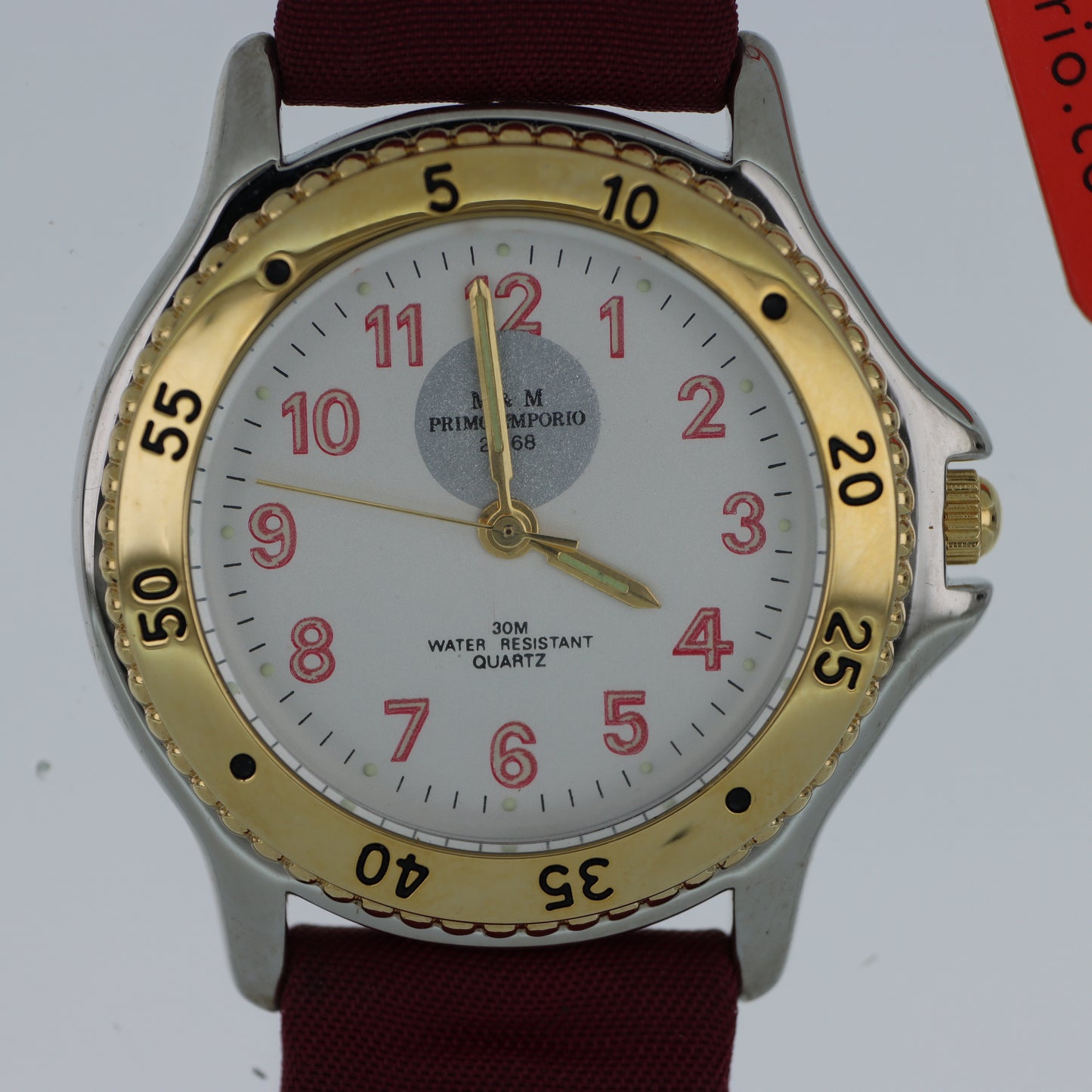 M.&M. Primo Emporio 21-68 – Orologio Uomo Sport Bezel Dorato Numeri Rossi Cinturino Tessuto 30M